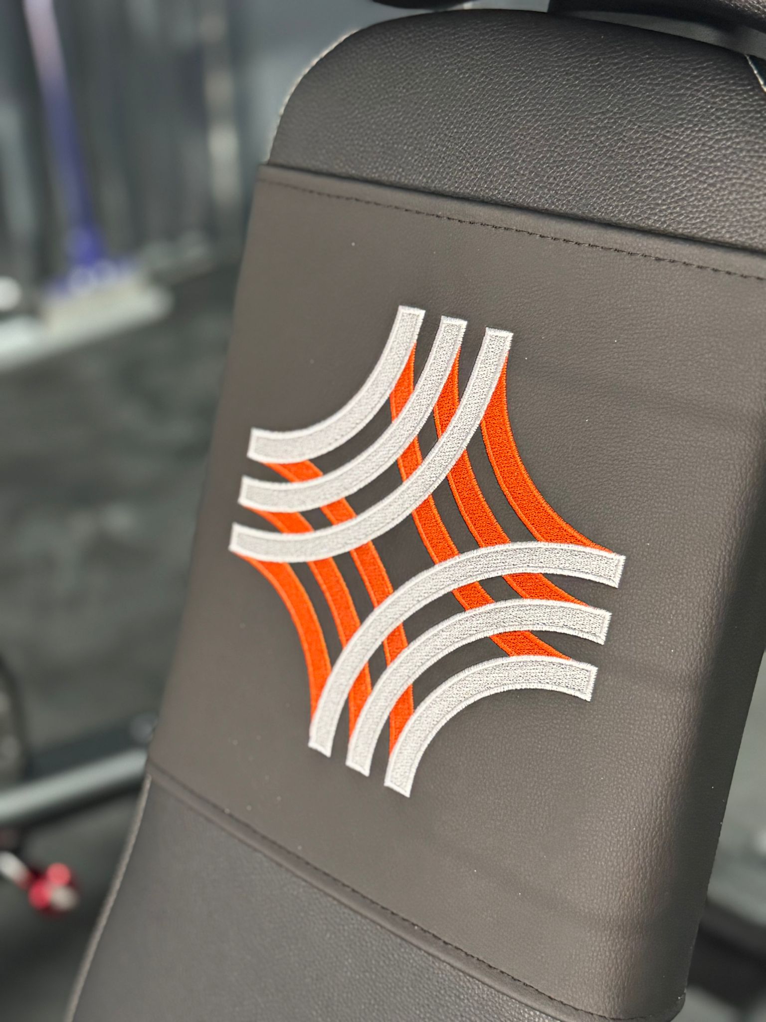 Close up of Legacy logo embroidered on gym equipment upholstery